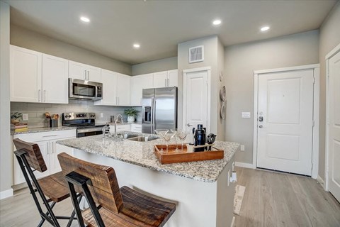 a kitchen with a granite counter top